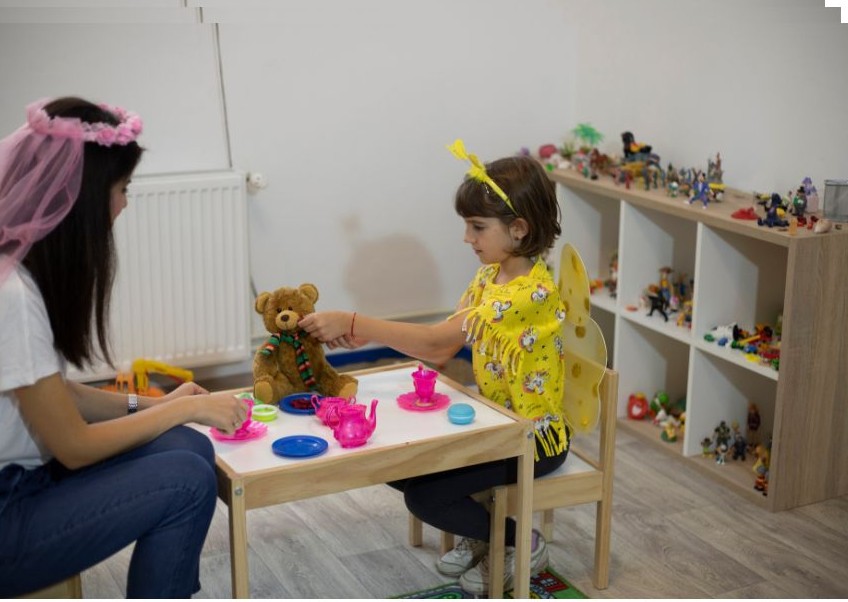 Child working with support professional